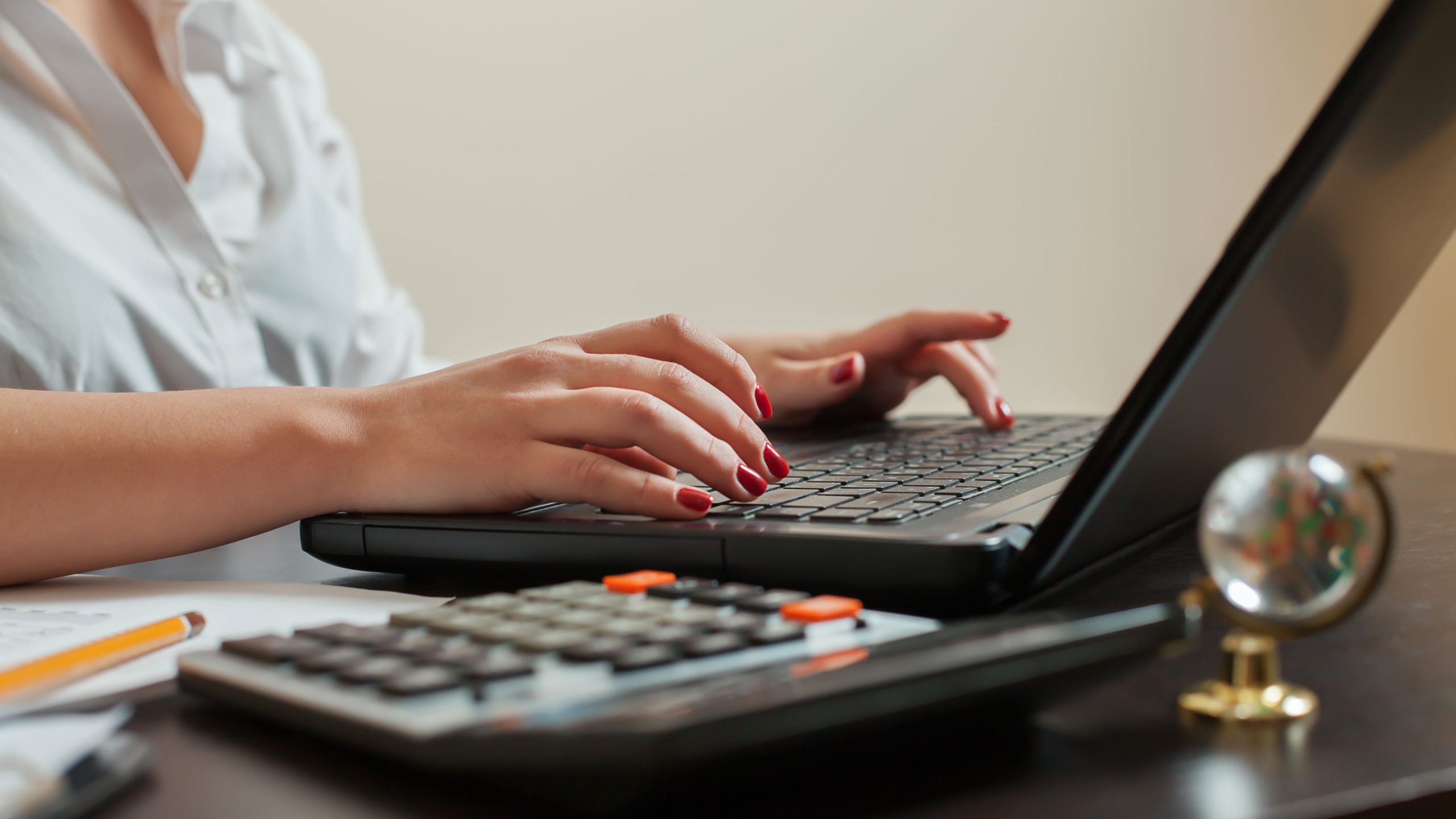 female-accountant-hands-keyboard-closeup